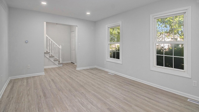 1796 Norfolk Ave, Ypsilanti, MI 48198 - unfurnished room featuring stairway, light wood-style flooring, and recessed lighting