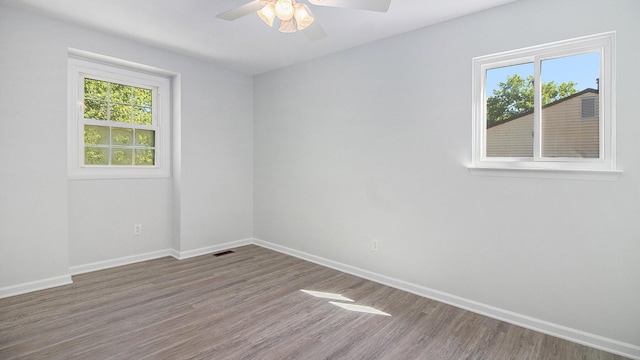 1796 Norfolk Ave, Ypsilanti, MI 48198 - spare room with plenty of natural light, ceiling fan, and wood finished floors