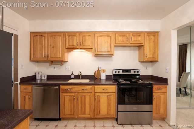7427 Radcliff Ct, West Bloomfield, MI 48322 - kitchen with stainless steel appliances, brown cabinetry, and light flooring