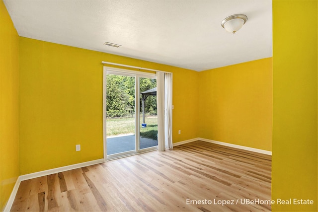 4061 Tributary Dr, Holland, MI 49424 - spare room featuring baseboards and wood finished floors