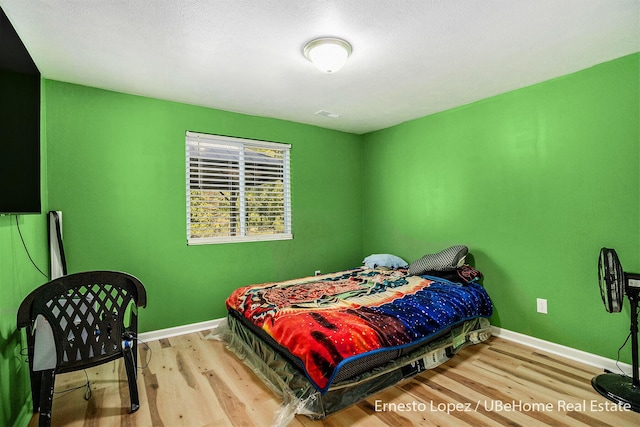 4061 Tributary Dr, Holland, MI 49424 - bedroom with wood finished floors and baseboards