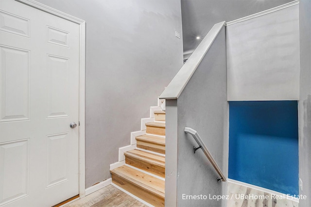 4061 Tributary Dr, Holland, MI 49424 - staircase featuring baseboards and wood finished floors