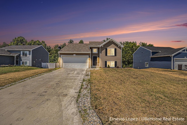 4061 Tributary Dr, Holland, MI 49424 - traditional-style house with driveway, an attached garage, and a front lawn