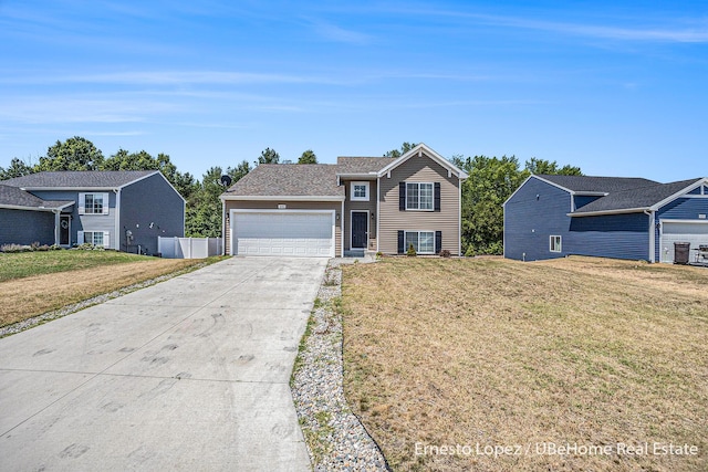 4061 Tributary Dr, Holland, MI 49424 - view of front facade featuring a garage, driveway, and a front yard