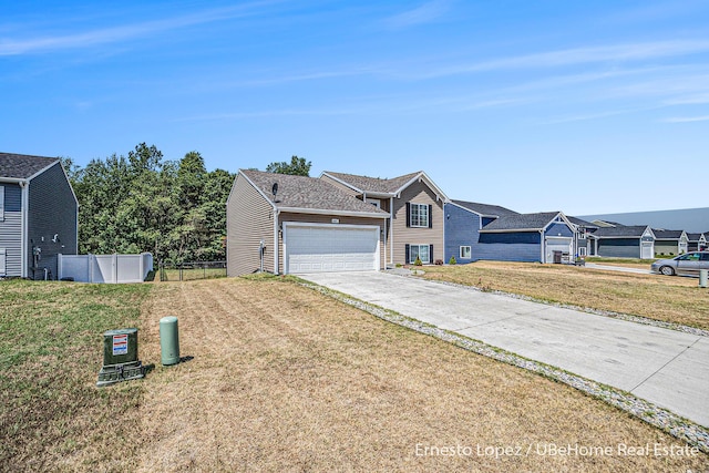 4061 Tributary Dr, Holland, MI 49424 - traditional-style house featuring concrete driveway and an attached garage