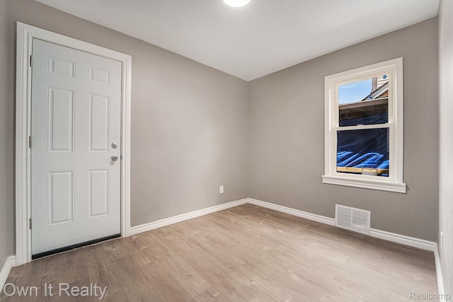 6031 Grandville Ave, Dearborn, MI 48228 - empty room with baseboards and wood finished floors