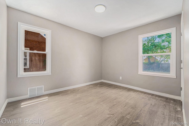 6031 Grandville Ave, Dearborn, MI 48228 - spare room featuring wood finished floors