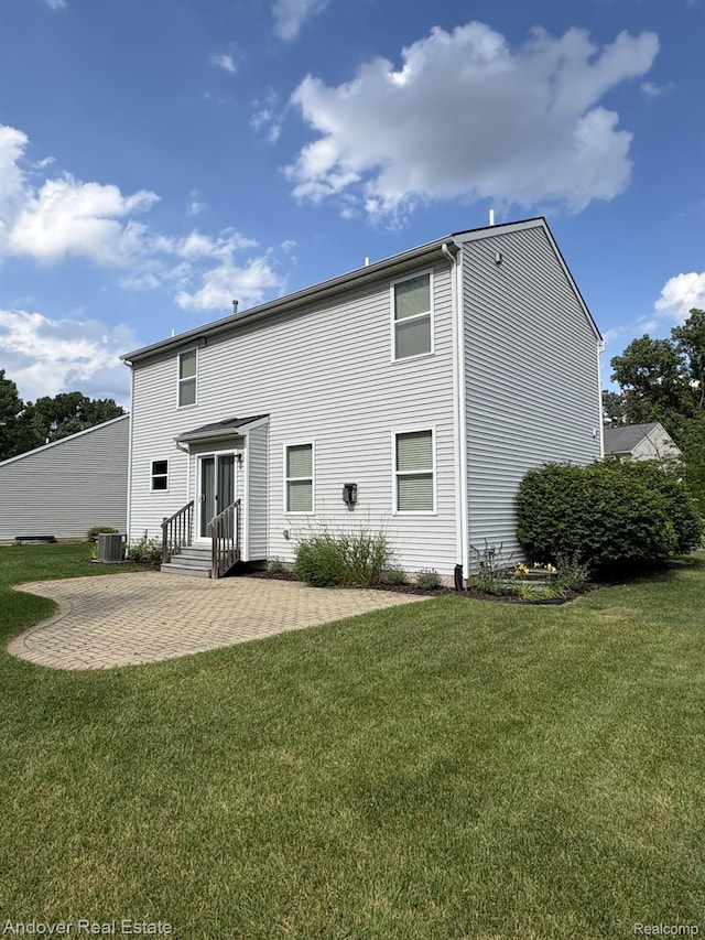 8213 Bayberry Ct, Dexter, MI 48130 - rear view of house featuring a patio and a lawn