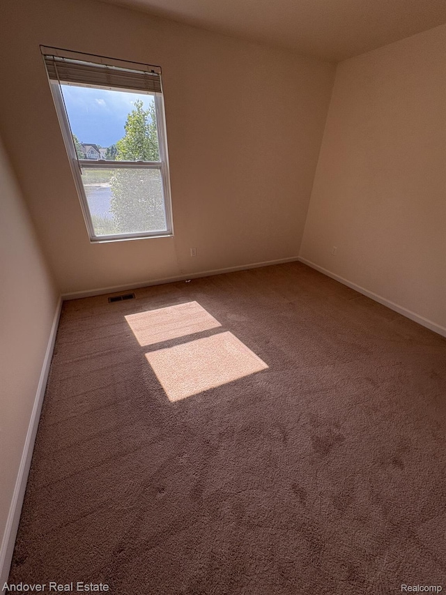 8213 Bayberry Ct, Dexter, MI 48130 - carpeted empty room featuring baseboards