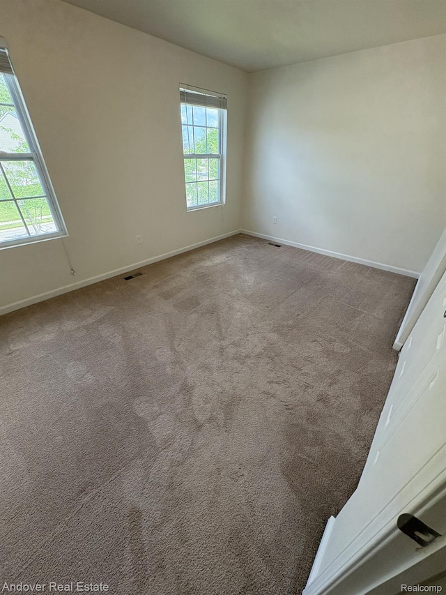 8213 Bayberry Ct, Dexter, MI 48130 - empty room with baseboards and carpet flooring