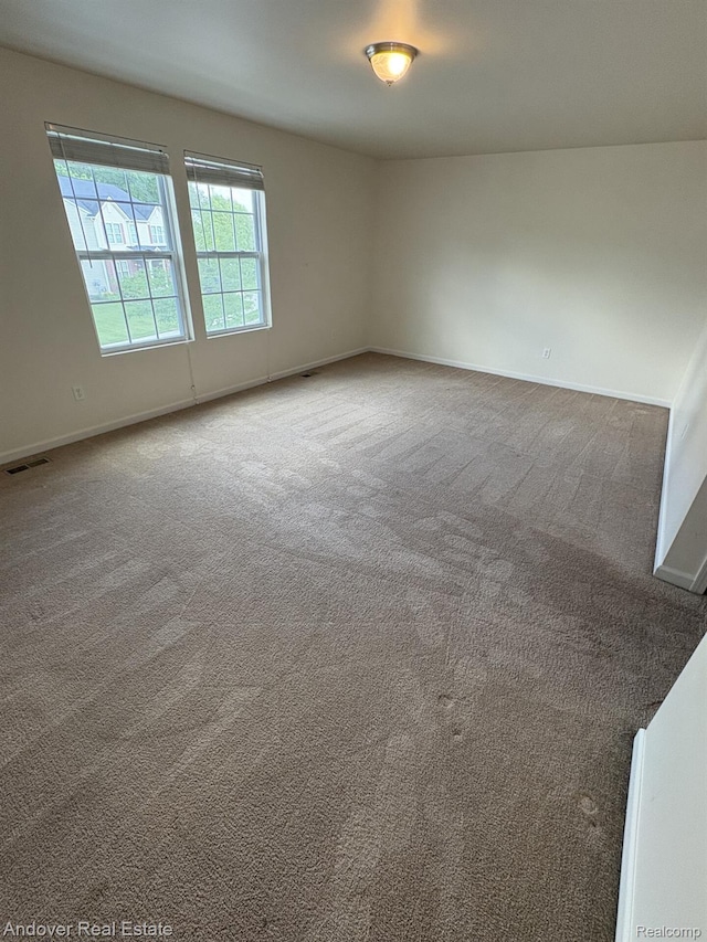 8213 Bayberry Ct, Dexter, MI 48130 - empty room featuring carpet flooring and baseboards