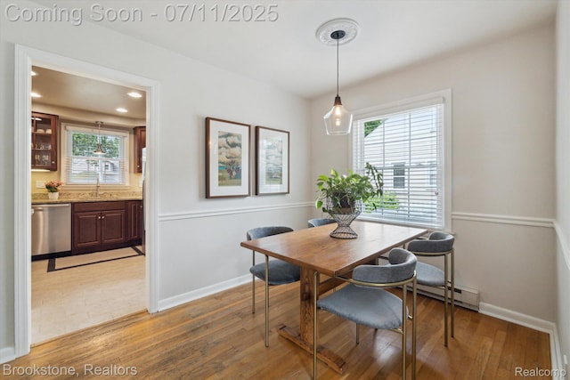 2351 Earlmont Rd, Berkley, MI 48072 - dining area with baseboard heating, light wood finished floors, and recessed lighting