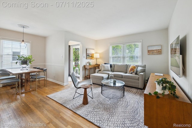 2351 Earlmont Rd, Berkley, MI 48072 - living area featuring wood finished floors and arched walkways
