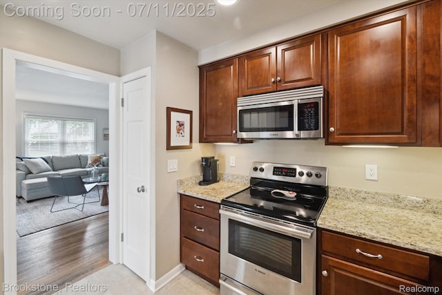 2351 Earlmont Rd, Berkley, MI 48072 - kitchen featuring appliances with stainless steel finishes and light stone countertops