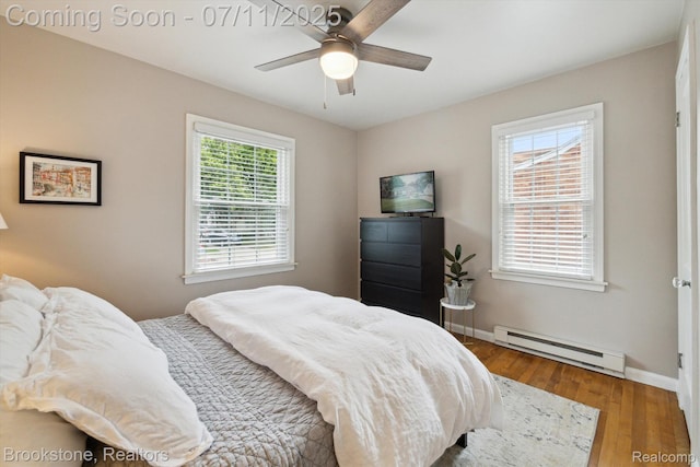 2351 Earlmont Rd, Berkley, MI 48072 - bedroom featuring baseboard heating, wood finished floors, and a ceiling fan