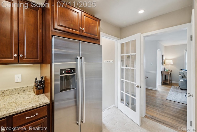 2351 Earlmont Rd, Berkley, MI 48072 - kitchen with high end fridge, light stone countertops, light tile patterned floors, and recessed lighting