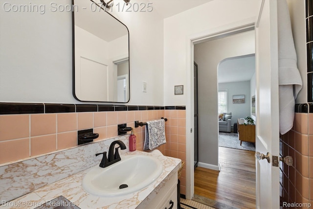 2351 Earlmont Rd, Berkley, MI 48072 - bathroom with vanity, wood finished floors, and tile walls