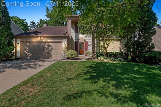 2686 Orbit Dr, Lake Orion, MI 48360 - view of front of house featuring a garage, driveway, and a front lawn