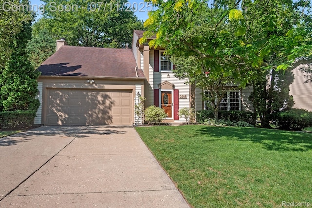 2686 Orbit Dr, Lake Orion, MI 48360 - view of front of property featuring a garage, a front yard, concrete driveway, and a chimney