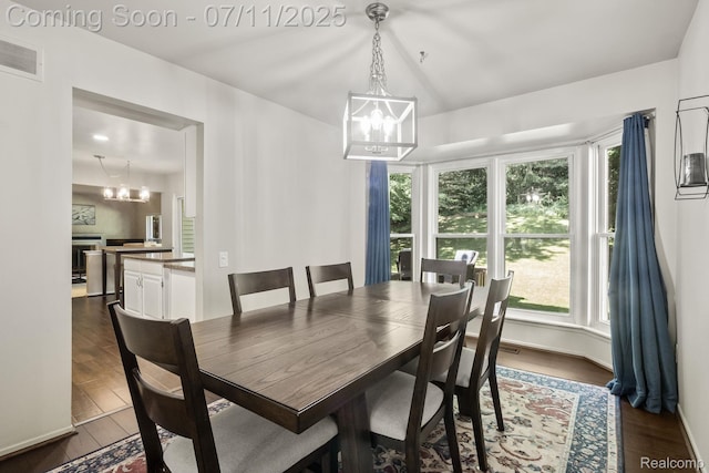 2686 Orbit Dr, Lake Orion, MI 48360 - dining area featuring a chandelier and dark wood-style floors