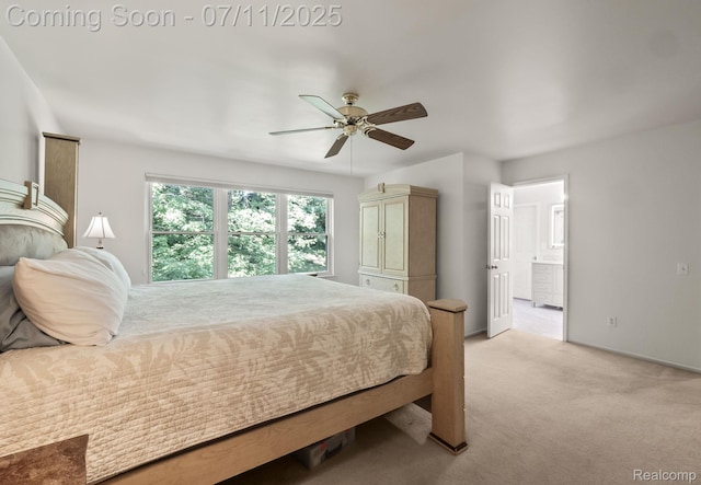 2686 Orbit Dr, Lake Orion, MI 48360 - bedroom with light colored carpet, ensuite bathroom, and ceiling fan