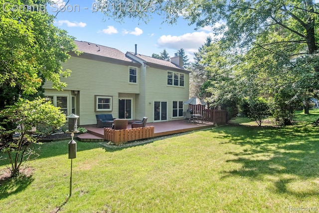 2686 Orbit Dr, Lake Orion, MI 48360 - back of house featuring a chimney, a yard, an outdoor living space, and a deck