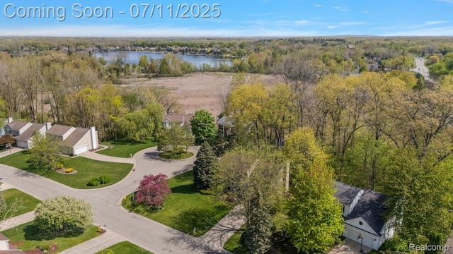 2686 Orbit Dr, Lake Orion, MI 48360 - aerial view of a heavily wooded area and a large body of water