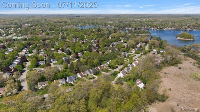 2686 Orbit Dr, Lake Orion, MI 48360 - aerial view of property's location with a large body of water and a forest
