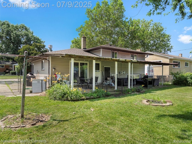 2553 Koper Dr, Macomb, MI 48310 - rear view of house with a chimney, a patio, and a gate