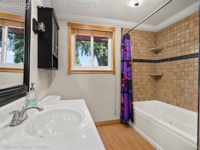 2553 Koper Dr, Macomb, MI 48310 - full bath with healthy amount of natural light, shower / tub combo with curtain, wood finished floors, ornamental molding, and vanity