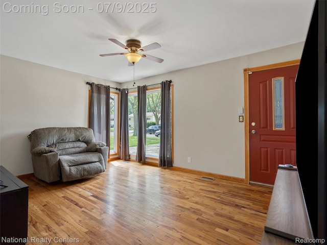 2553 Koper Dr, Macomb, MI 48310 - living room with a ceiling fan and light wood finished floors