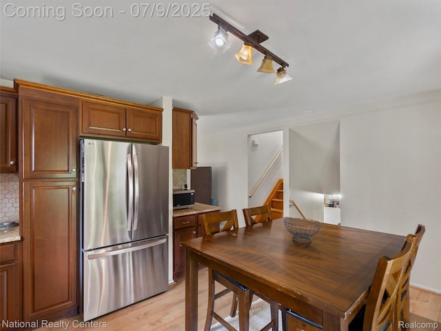 2553 Koper Dr, Macomb, MI 48310 - dining area featuring stairway and light wood-type flooring