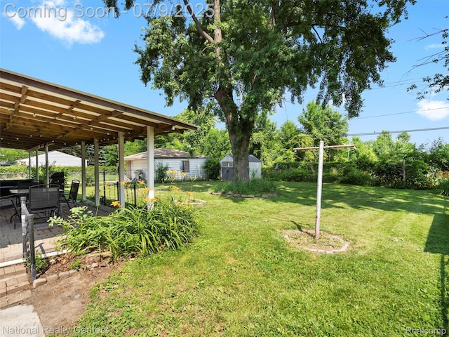 2553 Koper Dr, Macomb, MI 48310 - view of grassy yard featuring a patio and a shed