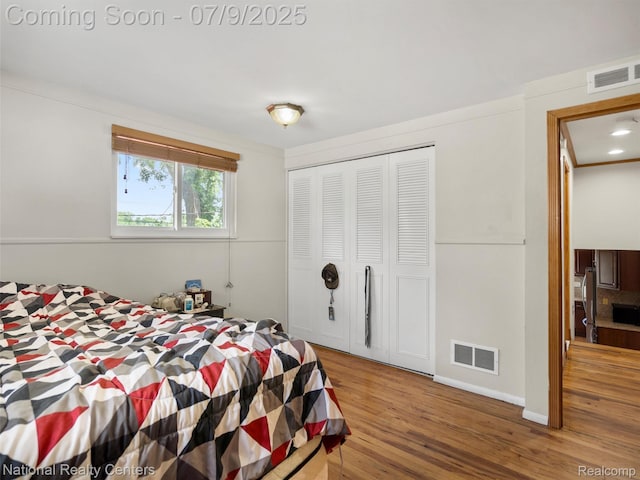 2553 Koper Dr, Macomb, MI 48310 - bedroom featuring wood finished floors and a closet
