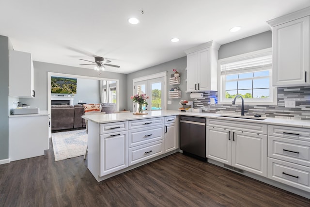10501 Somerset Rd, Cement City, MI 49233 - kitchen featuring dishwasher, a peninsula, open floor plan, a ceiling fan, and healthy amount of natural light