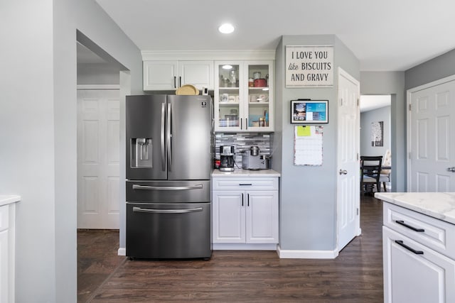 10501 Somerset Rd, Cement City, MI 49233 - kitchen with stainless steel refrigerator with ice dispenser, glass insert cabinets, white cabinetry, decorative backsplash, and recessed lighting