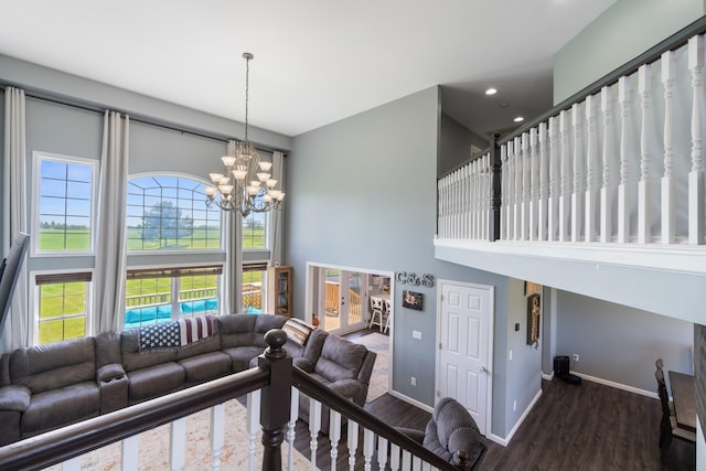 10501 Somerset Rd, Cement City, MI 49233 - living area featuring a high ceiling, wood finished floors, a chandelier, and recessed lighting