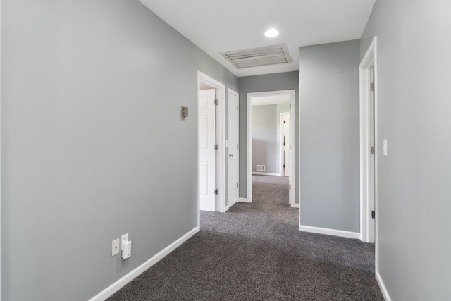 10501 Somerset Rd, Cement City, MI 49233 - hall featuring dark carpet and baseboards