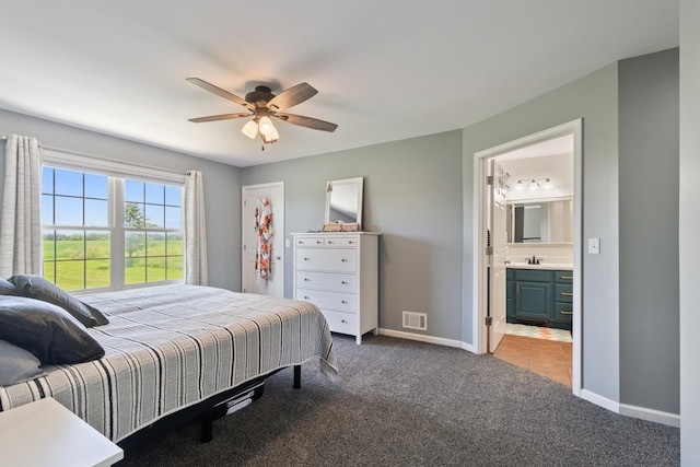 10501 Somerset Rd, Cement City, MI 49233 - bedroom with carpet floors, connected bathroom, and a ceiling fan