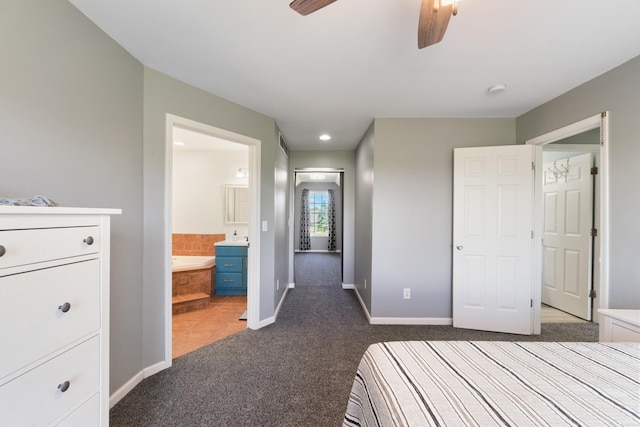10501 Somerset Rd, Cement City, MI 49233 - unfurnished bedroom with dark carpet, connected bathroom, recessed lighting, and ceiling fan