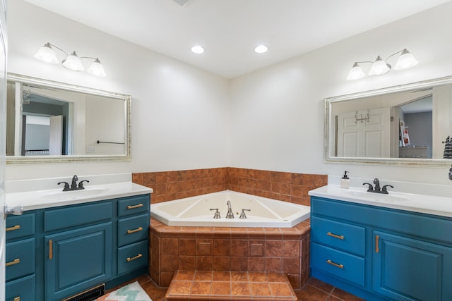 10501 Somerset Rd, Cement City, MI 49233 - full bath featuring two vanities, a garden tub, tile patterned floors, and recessed lighting