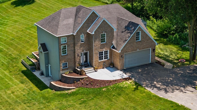 10501 Somerset Rd, Cement City, MI 49233 - view of front of home featuring asphalt driveway, a garage, and a front yard