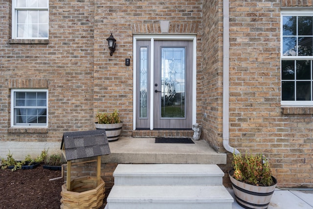 10501 Somerset Rd, Cement City, MI 49233 - property entrance featuring brick siding