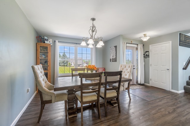 10501 Somerset Rd, Cement City, MI 49233 - dining room featuring healthy amount of natural light, dark wood-type flooring, a chandelier, and stairs