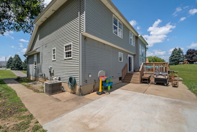 10501 Somerset Rd, Cement City, MI 49233 - rear view of property featuring a patio area and a wooden deck