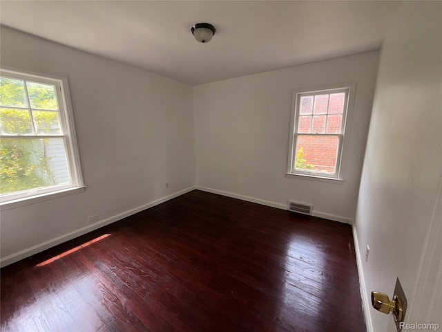 5565 Oldtown St, Detroit, MI 48224 - spare room with wood-type flooring and baseboards
