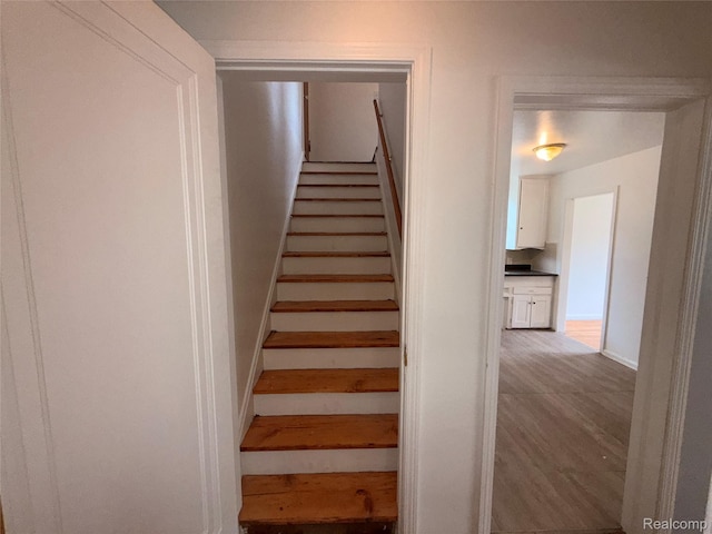 5565 Oldtown St, Detroit, MI 48224 - stairs with baseboards and wood finished floors