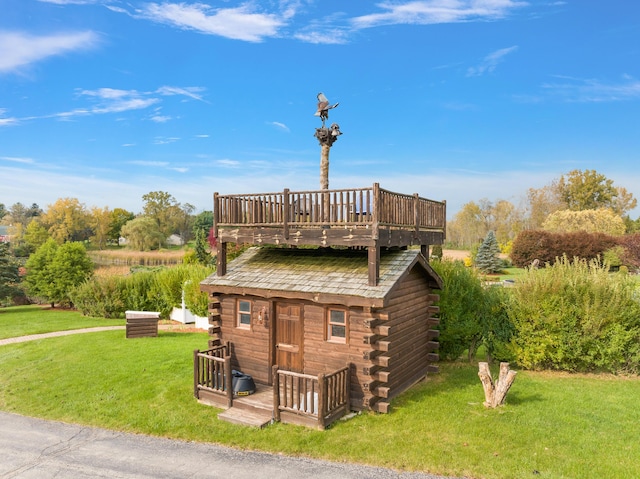 4700 Raap Rd, Bruce, MI 48065 - rear view of house with log siding, a lawn, a deck, and an outdoor structure