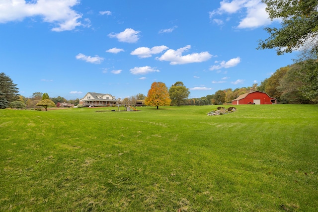 4700 Raap Rd, Bruce, MI 48065 - view of grassy yard with a playground and an outbuilding