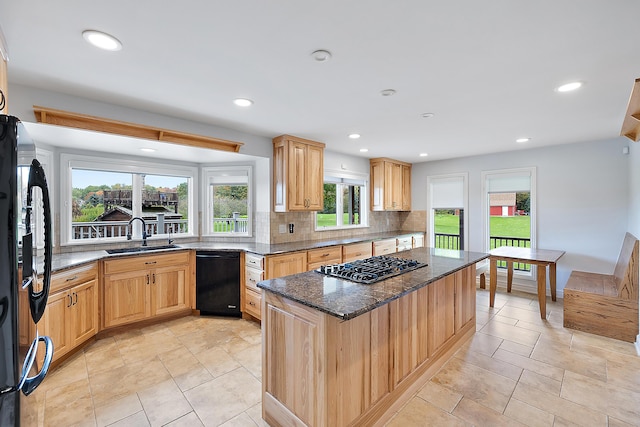 4700 Raap Rd, Bruce, MI 48065 - kitchen with black appliances, decorative backsplash, dark stone countertops, a kitchen island, and recessed lighting